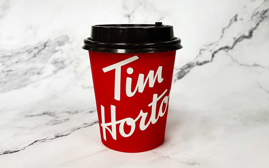 Photoshop assignment, A product photo of a small Tim Hortons coffee placed on a marble backdrop and then edited in adobe photoshop